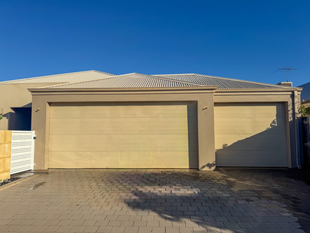 Dated garage door colour in a dirty cream